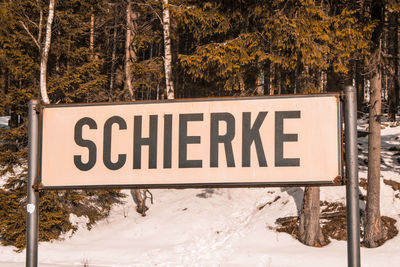 Information sign on snow covered land