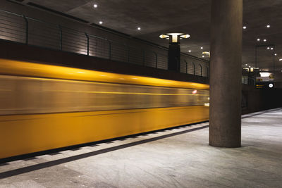 Blurred motion of train at railroad station at night