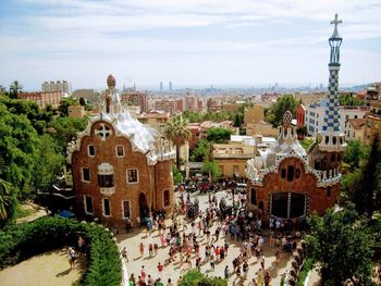 High angle view of people on street amidst buildings in city