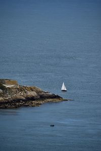 Scenic view of sea against blue sky