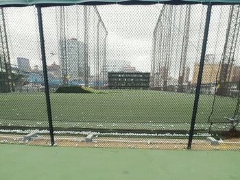 Field seen through chainlink fence