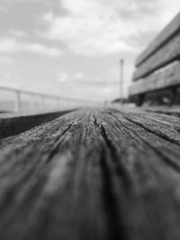 Surface level of wood against sky