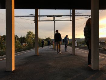 People standing at railroad station