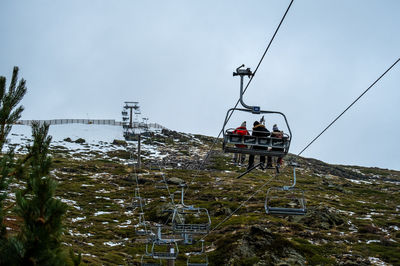 View of ski lift in sierra nevada capped mountain.