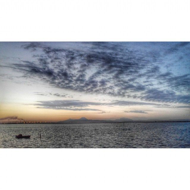 sea, water, tranquil scene, sky, horizon over water, scenics, tranquility, beauty in nature, sunset, cloud - sky, nature, idyllic, cloud, transfer print, cloudy, auto post production filter, calm, beach, waterfront, outdoors