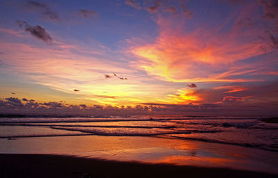 Scenic view of sea against sky at sunset