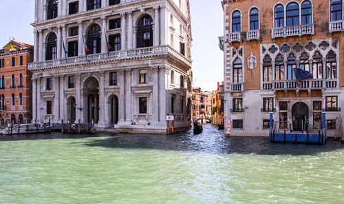 Canal passing through city buildings