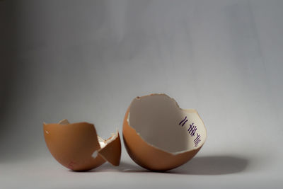 Close-up of egg against white background