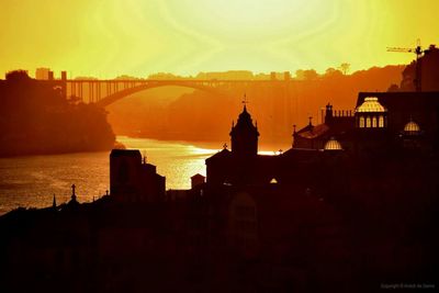 Silhouette of built structure at sunset