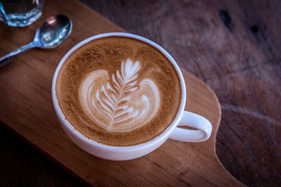 Close-up of cappuccino on table