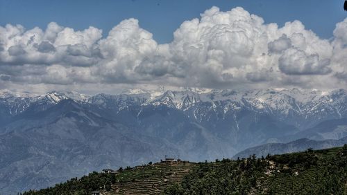 Panoramic view of snowcapped mountains against sky