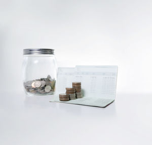 Glass of jar against white background