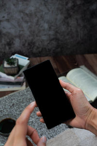 Midsection of person using mobile phone