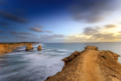 Scenic view of sea against sky at sunset