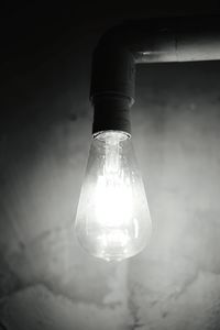 Low angle view of illuminated light bulb