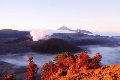 Scenic view of mountains against sky at sunset