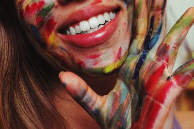 Midsection of woman covered with paint