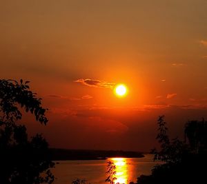 Scenic view of sea against romantic sky at sunset