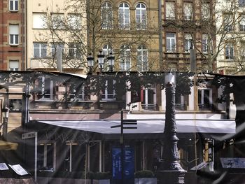 Reflection of building on street in city