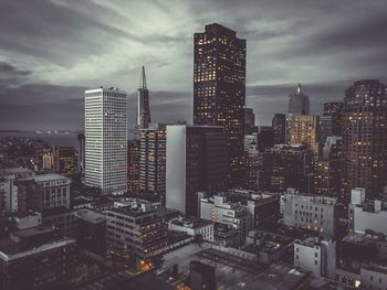 View of skyscrapers lit up at night