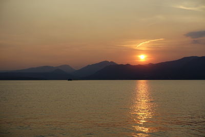 Scenic view of silhouette mountains against sky during sunset