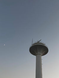 Low angle view of water tower against clear sky