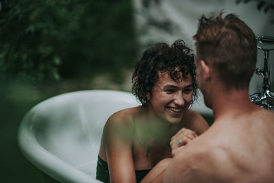 Portrait of shirtless man in water