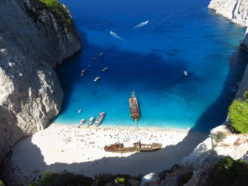 High angle view of boats at beach during sunny day