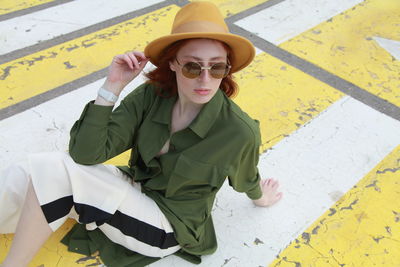 Portrait of young woman wearing sunglasses