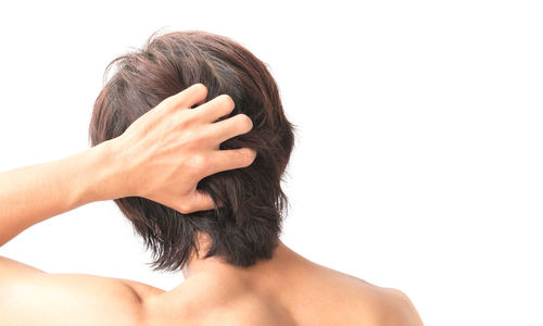 Close-up of woman with hand on white background