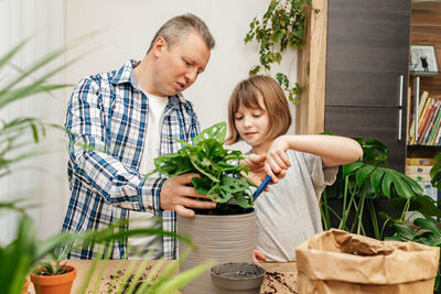 Side view of senior man preparing food at home