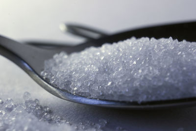 Macro of a healthy sea salt on metal spoon closeup