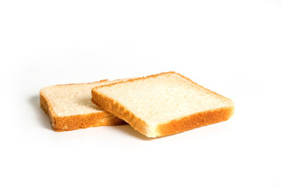 Close-up of cake against white background