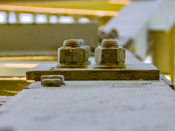 Close-up of rusty metal on table