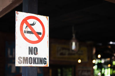 Close-up of no smoking sign outdoors
