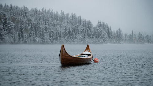 Boat in lake during winter