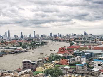 High angle view of buildings in city against sky