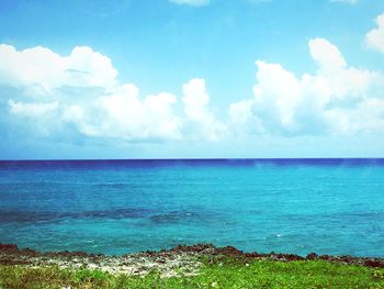 View of calm sea against cloudy sky