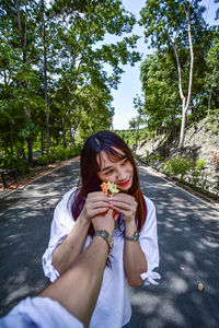 Full length of woman eating food