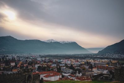 High angle view of townscape and mountains against sky