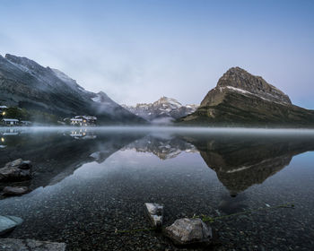 Scenic view of lake against cloudy sky