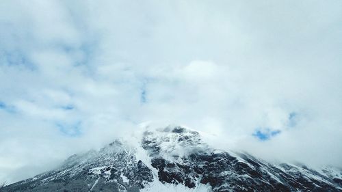 Scenic view of snowcapped mountain against sky