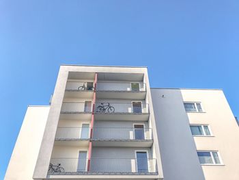 Low angle view of building against clear blue sky