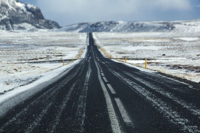 Wet and slippery road in iceland, winter