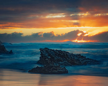 Scenic view of sea against sky during sunset