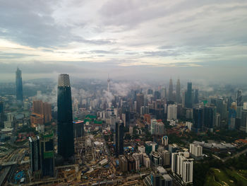 High angle view of buildings in city against sky