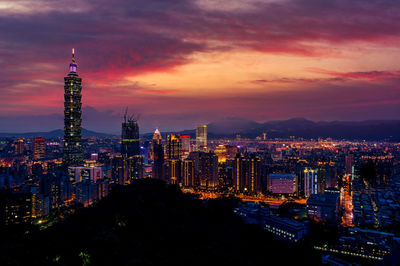 Illuminated buildings in city at night