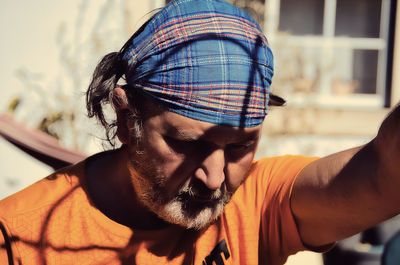Close-up portrait of man wearing mask