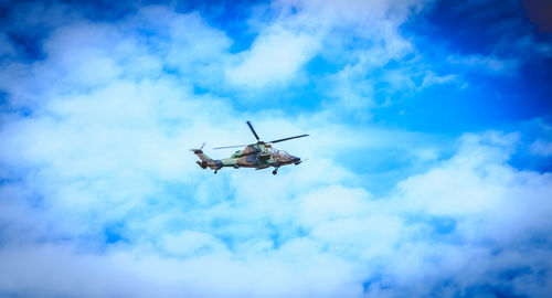 Low angle view of airplane flying in sky