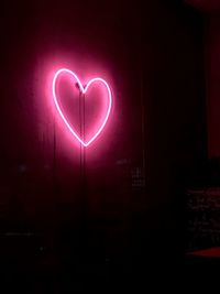 Heart shape made from illuminated light painting on wall